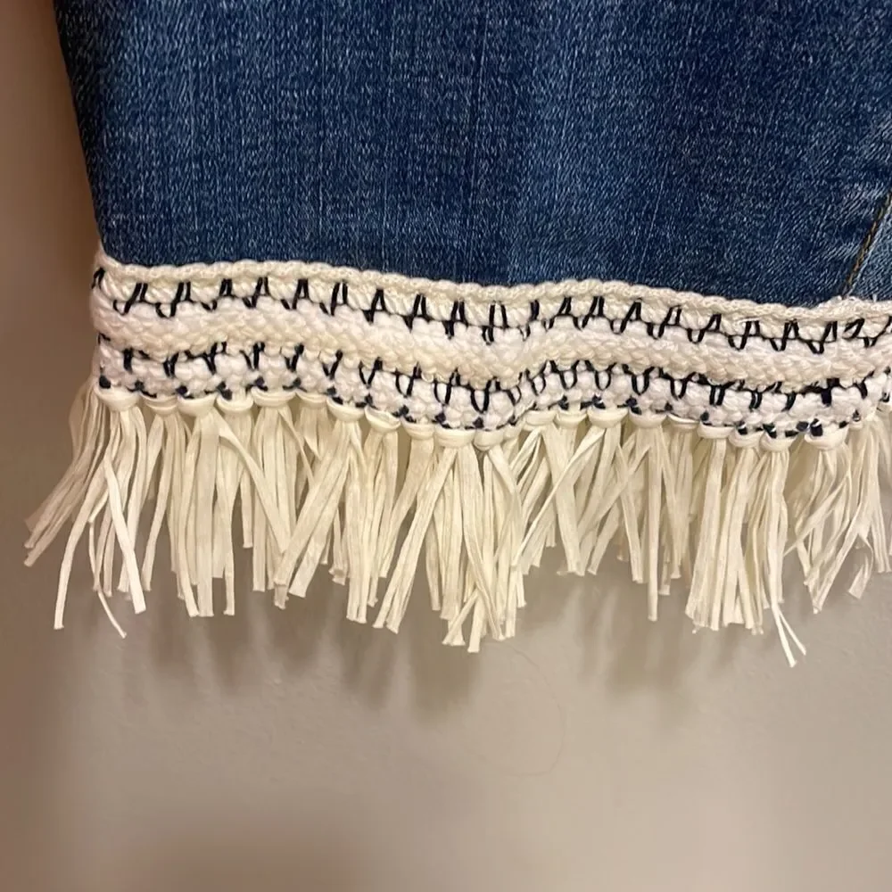 Tory Burch Connor jeans in medium allover stone wash. Cropped. Raffia fringed